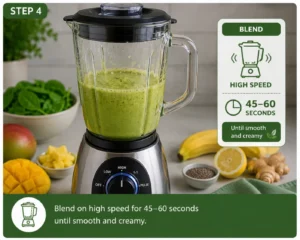 Blending a Detox Island Green Smoothie on high speed until smooth and creamy in a high-speed blender.