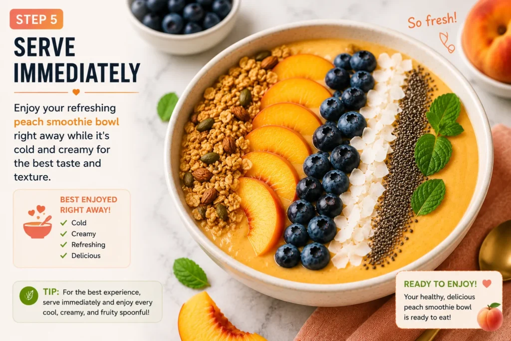 Fresh peach smoothie bowl topped with granola, peach slices, blueberries, coconut flakes, chia seeds, and mint leaves, ready to serve immediately.